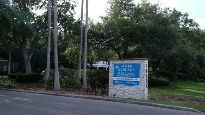 Entrance sign for Tampa Gardens Senior Living