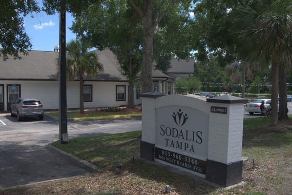 Exterior view of Sodalis Tampa with building sign and surroundings