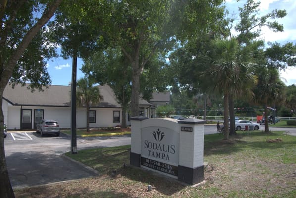 Exterior view of Sodalis Tampa sign and parking lot