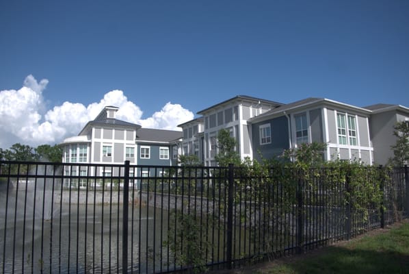 View of the Meridian at Brandon building by a pond