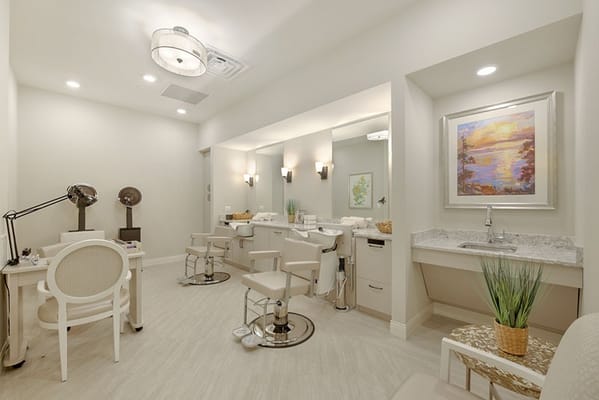 Interior of a beauty salon with styling stations and mirrors