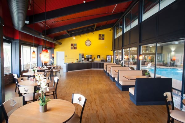 Interior view of a bright common area with seating