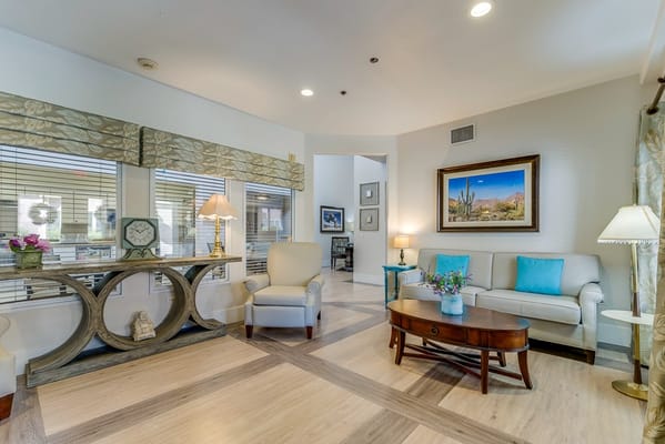 Bright common area with comfortable seating and artwork