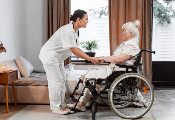 Caregiver assisting a resident in a bright room