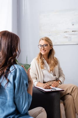 A staff member engaging with a resident in conversation