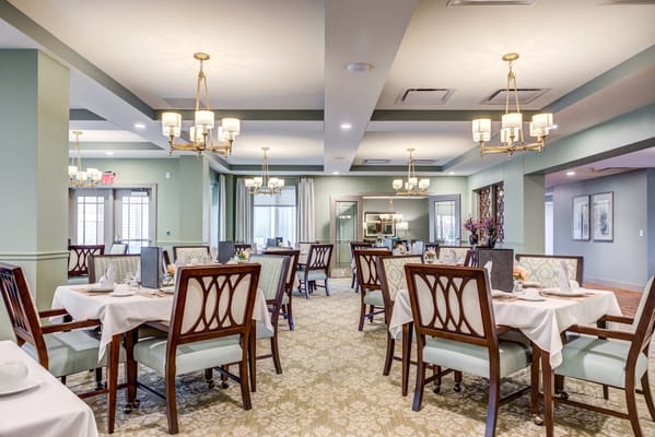 Elegant dining room setup with tables and chairs