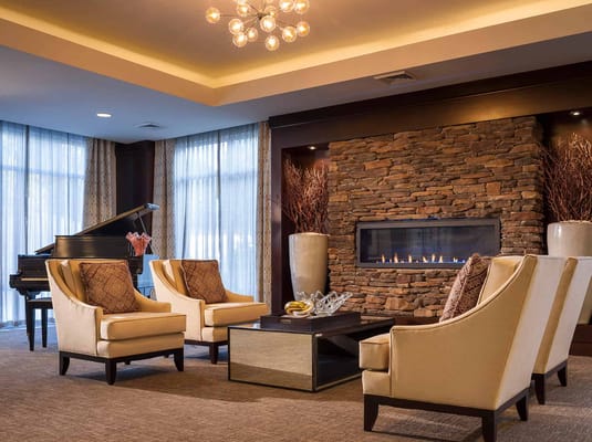 Cozy common area with seating and a fireplace