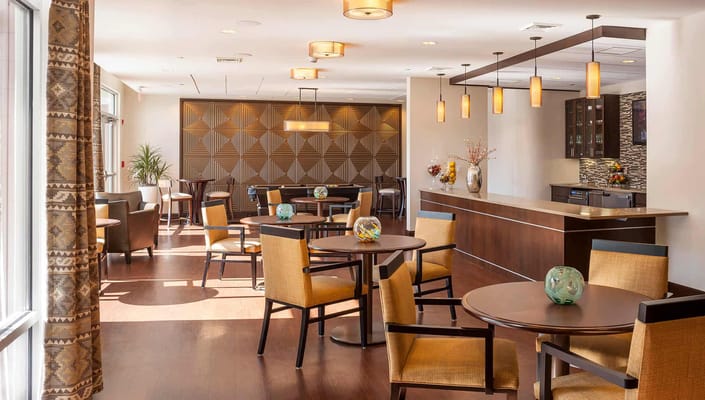 Bright dining area with tables and chairs