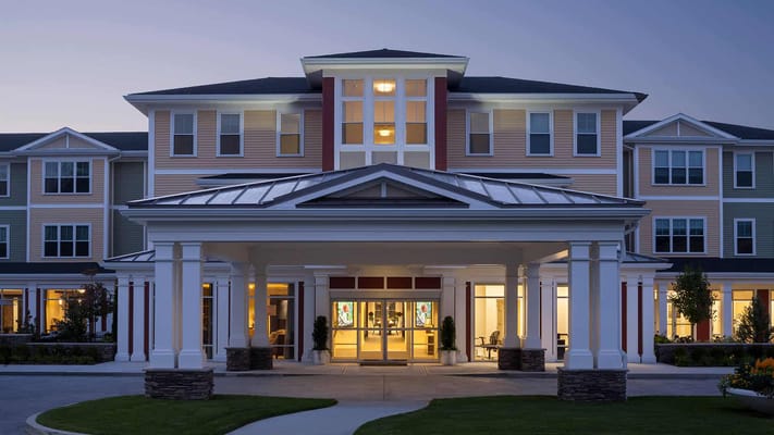 Exterior view of Wingate Residences at Needham at dusk