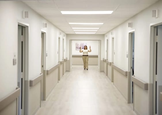 A well-lit hallway in a senior living facility