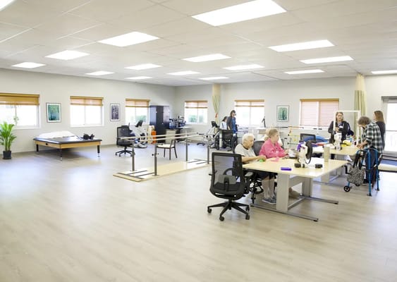 Residents and staff engaged in an activity room
