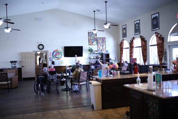 Residents and staff interacting in a common area