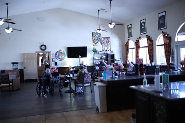 Residents engaging in activities in a community lounge
