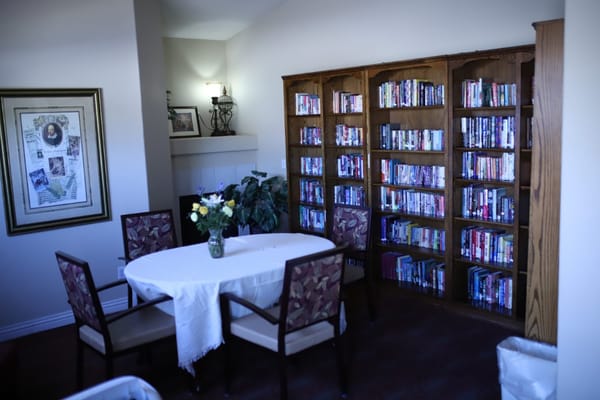 Cozy reading area with bookshelves and a small table