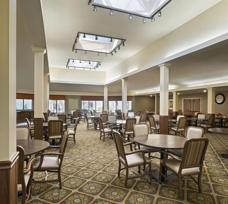 Bright common area with tables and chairs