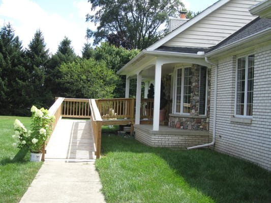 Exterior view of a senior living facility with accessible ramp
