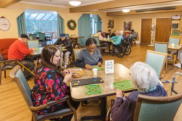 Residents playing bingo in a common area