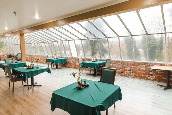 Bright dining area with tables and chairs