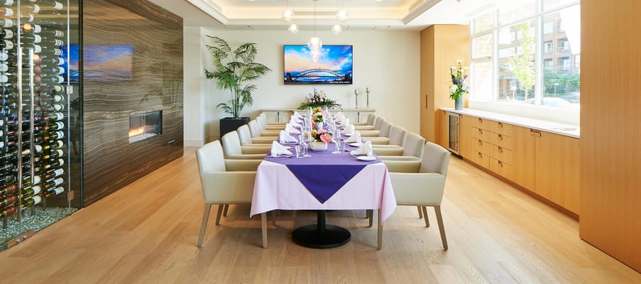 Elegant dining room setup with flowers and wine storage