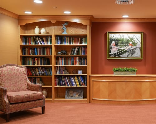 Cozy interior library area with bookshelves and seating
