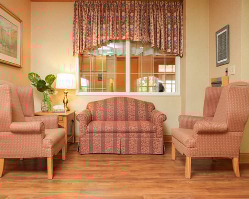 Cozy seating area in a common space with natural light