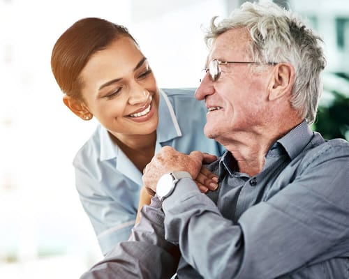 A caregiver interacting with a resident in a supportive manner
