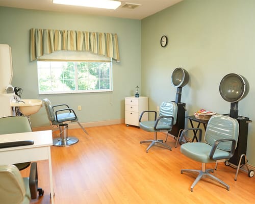 Hair salon area with styling chairs and equipment