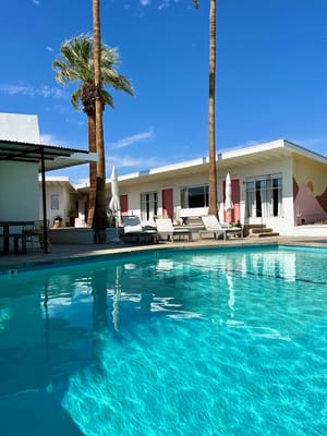 A beautiful outdoor pool area with palm trees