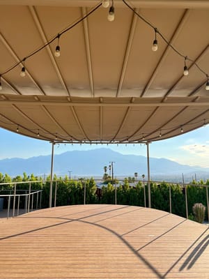 Outdoor space with a view and string lights
