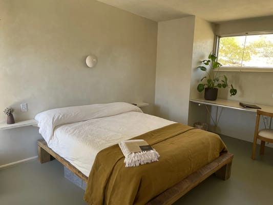 Cozy bedroom setup with a bed and natural light