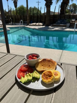 Breakfast with fruit by the poolside.