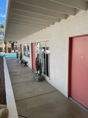 Exterior view of the facility with pathway and doors