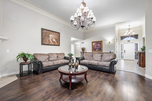 Cozy common area with comfortable seating and chandelier