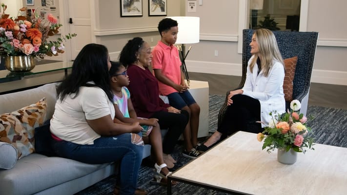 Residents and staff interacting in a welcoming common area