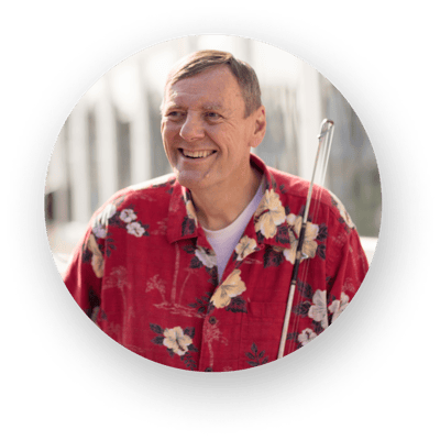 Smiling resident wearing a floral shirt outdoors