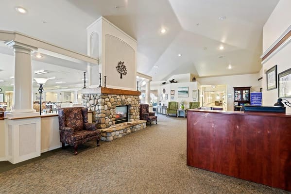 Interior view of a cozy lounge area with a fireplace