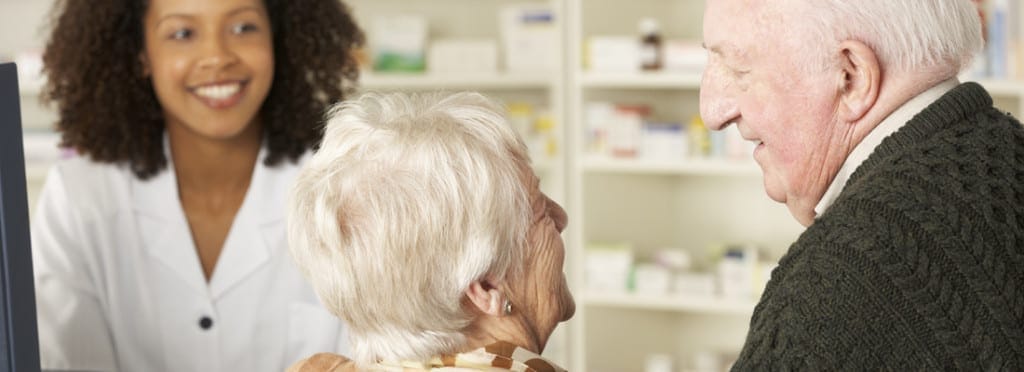 Staff interacting with an elderly resident in a facility setting