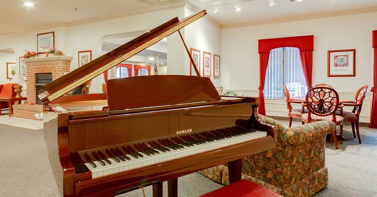 Interior view of a common area featuring a piano