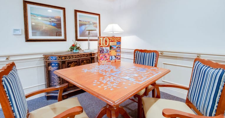 Activity room with a puzzle and seating