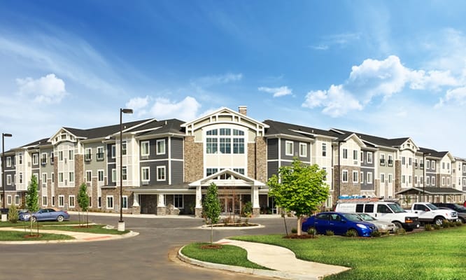 Exterior view of the senior living facility with landscaping