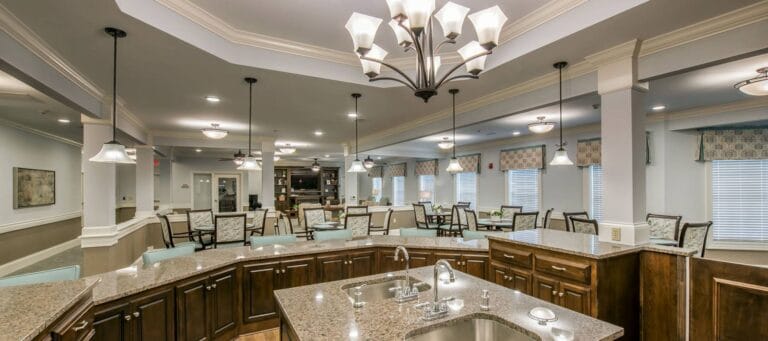 Bright common area with seating and decorative lighting