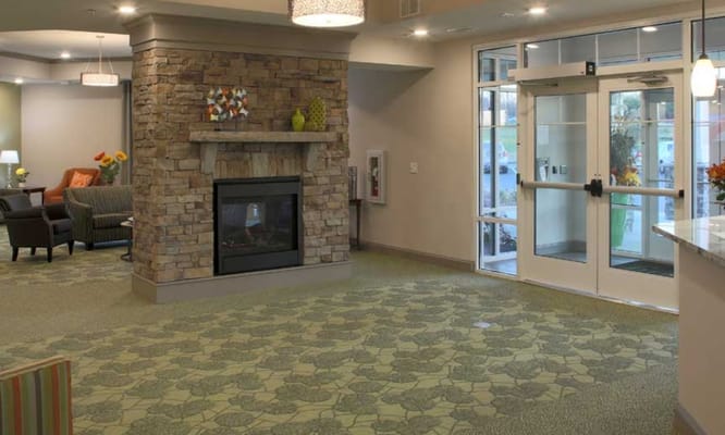 Interior view of a welcoming common area with a fireplace