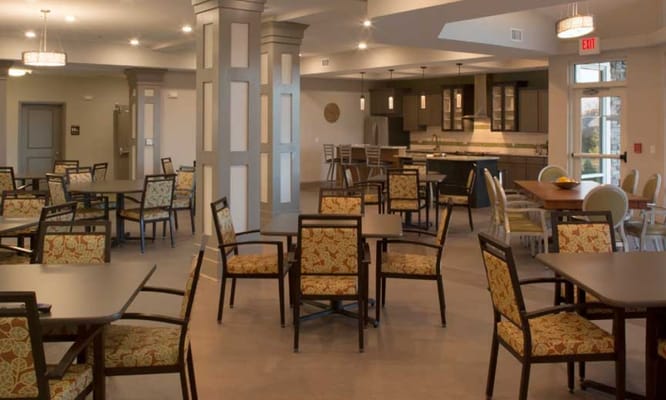 Dining area with tables and chairs in a modern setting