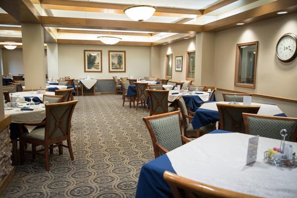Dining area with neatly set tables and decor