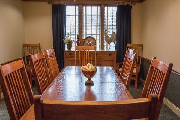 Dining area with wooden table and chairs