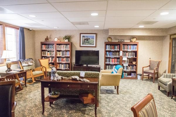 Cozy common area with bookshelves and seating