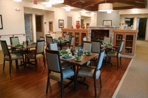 Dining room set up for a meal with green tableware
