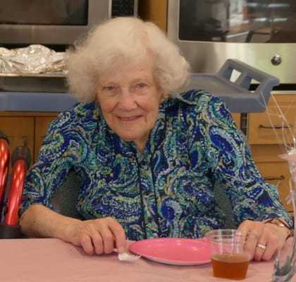 Seniors enjoying a meal at a dining table