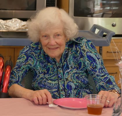 Seniors enjoying a meal at a dining table