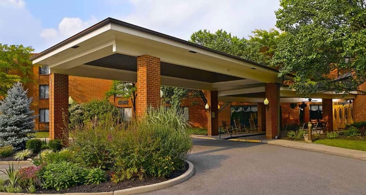 Entrance of a senior living facility with landscaping